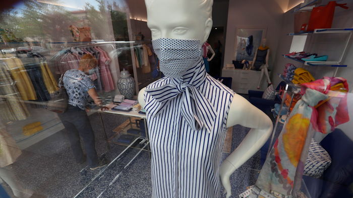A mannequin displays fashion masks for shoppers the buy at the Highland Park Village shopping center in Dallas.
