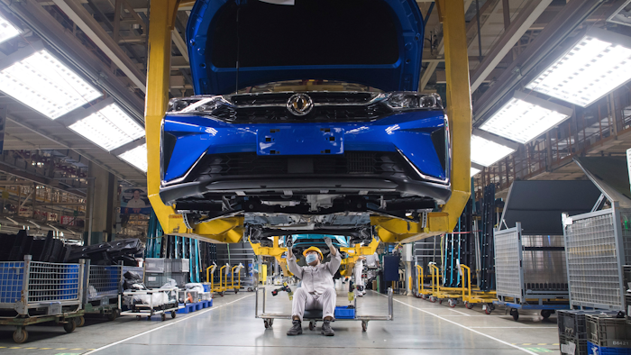 Workers at an assembly line for Dongfeng Passenger Vehicle Company in Wuhan.