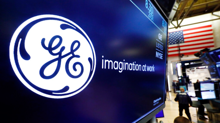 In this Aug. 16, 2019, file photo the logo for General Electric appears above a trading post on the floor of the New York Stock Exchange.
