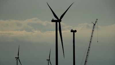 Completed wind turbines stand on a hilltop at the Reading Wind Facility in Reading, Kan., on Monday, April 27, 2020.