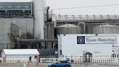 In this Friday, May 1 photo, a worker leaves the Tyson Foods plant in Waterloo, Iowa.