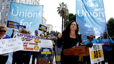 Assemblywoman Lorena Gonzalez, D-San Diego, speaks at rally calling for passage of her measure.