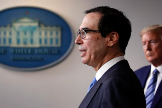 President Donald Trump listens as Treasury Secretary Steven Mnuchin speaks about the coronavirus.