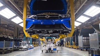 Workers at an assembly line for Dongfeng Passenger Vehicle Company in Wuhan.