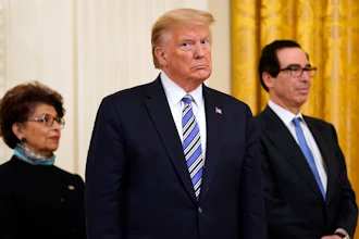 President Donald Trump, along with Jovita Carranza, administrator of the Small Business Administration, and Treasury Secretary Steven Mnuchin.