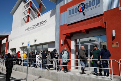 People wait in line for help with unemployment benefits in Las Vegas, NV.