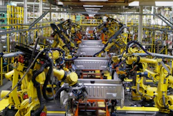 In this Sept. 27, 2018 file photo, robots weld the bed of a 2018 Ford F-150 truck on the assembly line at the Ford Rouge assembly plant in Dearborn, Mich.