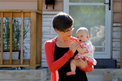 Sara Adelman holds her daughter Amelia in Salt Lake City.