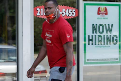 A man walks past a Marco's Pizza in Euclid, Ohio, June 5, 2020.