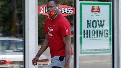 A man walks past a Marco's Pizza in Euclid, Ohio, June 5, 2020.