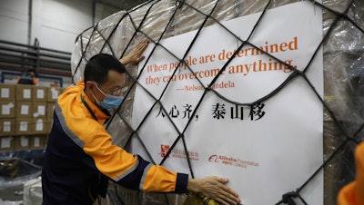 A worker prepares the first batch of donation from the Jack Ma Foundation and Alibaba Foundation bound for Africa.