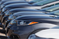 In this file photo dated Sunday, June 7, 2020, a long row of unsold cars at a Honda dealership in Highlands Ranch, USA.