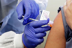 In this March 16, 2020, file photo, Neal Browning receives a shot in the first-stage safety study clinical trial of a potential vaccine for COVID-19, the disease caused by the new coronavirus, at the Kaiser Permanente Washington Health Research Institute in Seattle.