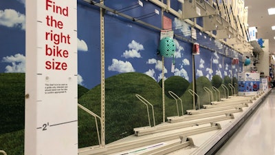 Bicycle display racks are empty at a Target in Milford, Mass.