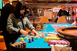 A dealer handling stacks of chips on a roulette table at the Tropicana Casino and Resort in Atlantic City, N.J., April 17, 2015.