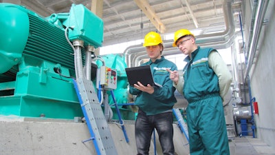 Industrial Workers With Notebook 000050189250 Small