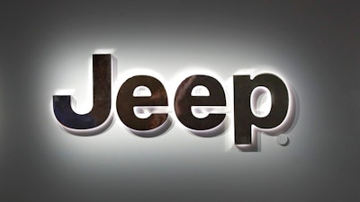 This Jan. 14, 2019 photo shows a Jeep logo at the North American International Auto Show in Detroit. Fiat Chrysler is recalling almost 95,000 Jeep Cherokees worldwide, Thursday, June 18, 2020, because a transmission problem can cause the small SUVs to lose power unexpectedly. The recall covers certain Cherokees from the 2014 through 2017 model years and includes about 2,700 replacement parts.