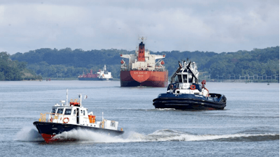 Cargo ships navigate Panama Canal waters in Gamboa, Panama, Wednesday, June 17, 2020. The Panama Canal began to feel the first adverse effects of the coronavirus pandemic on its business after registering a drop in its ship transits while applying rigorous measures to prevent further contagion among its workers.