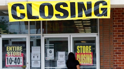 A woman walks into a closing Gordmans store, Thursday, May 28, 2020, in St. Charles, Mo. Stage Stores, which owns Gordmans, is closing all its stores and has filed for Chapter 11 bankruptcy.