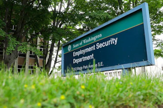 In this May 26, 2020, file photo, is a sign at the headquarters for Washington state's Employment Security Department at the Capitol in Olympia, Wash. Washington officials say they believe they have recovered about half of the up to $650 million in unemployment benefits paid to criminals who used stolen identities to file claims during the coronavirus pandemic.