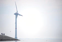 Cyclists ride along the dyke in Emden, Germany, Wednesday, June 3, 2020. The German government wants to increase offshore wind power capacity five-fold by 2040 as part of its plan to wean the country off fossil fuels. Cabinet on Wednesday agreed a bill that would set a goal of 40 Gigawatts of installed offshore wind power capacity in 20 years, from about 7.5 Gigawatts at present. It also raised the target for 2030 from 15 Gigawatts to 20.
