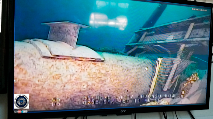 Shot from a television screen shows damage to anchor support.