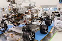 Engineers watch the first driving test for the Mars 2020 rover Perseverance in a clean room at the Jet Propulsion Laboratory in Pasadena, Calif., Dec. 17, 2019.