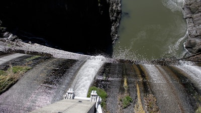 Excess water spills over the top of a dam on the lower Klamath River.