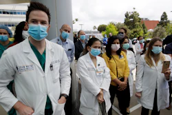 Hospital personnel stand outside Providence St. John's Medical Center in Santa Monica, Calif.