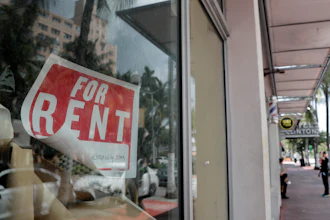 For Rent sign hangs on a closed shop.