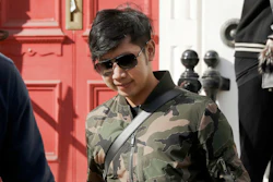 Vorayuth 'Boss' Yoovidhya walks to get in a car as he leaves a house in London.