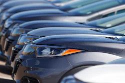 In this file photo dated June 7, 2020, a long row of unsold cars at a Honda dealership in Highlands Ranch, Colo. The coronavirus pandemic is causing drivers to keep their cars and trucks longer. The IHS Markit consulting firm says the pandemic has caused consumers to put the brakes on spending and hold onto their current vehicles for a longer period.