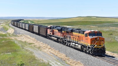 A BNSF Railway train hauling carloads of coal from the Powder River Basin of Montana and Wyoming is seen east of Hardin, Mont., on July 15, 2020. A coalition of states is renewing its push to stop the Trump administration from selling coal from public lands.