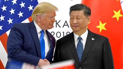 In this June 29, 2019, file photo, U.S. President Donald Trump, left, shakes hands with Chinese President Xi Jinping during a meeting on the sidelines of the G-20 summit in Osaka, western Japan. The ongoing sharp deterioration in U.S.-China ties poses risks to both countries and the rest of the world. With the U.S. presidential campaign heating up, all bets are that relations with China will only get worse. At stake are global trade, technology and security.