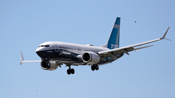 A Boeing 737 MAX jet heads to a landing at Boeing Field following a test flight.