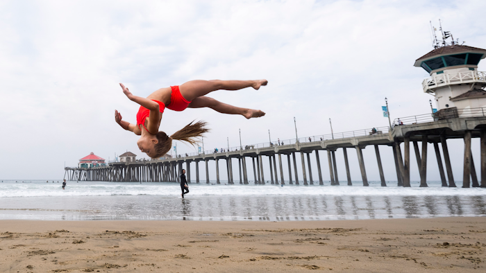 A student works on her skills during an acrobatics class near the pier in Huntington Beach, CA.