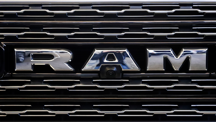 The Ram logo on the front grill of a Ram 1500.