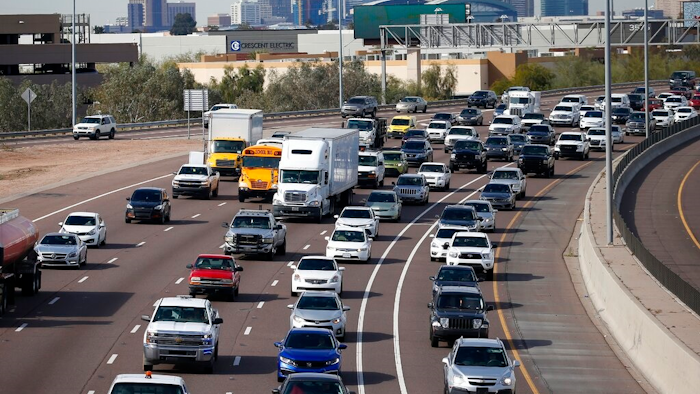 In this Jan. 24, 2020 file photo, early rush hour traffic rolls along I-10 in Phoenix. The U.S. government’s road safety agency is offering a smartphone app that will alert drivers if their vehicles are recalled. The National Highway Traffic Safety Administration was to roll out the app for Android and Apple phones on Thursday, Aug. 27.