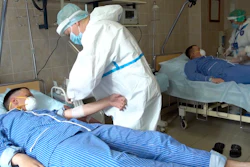 Medical workers prepare to draw blood from volunteers participating in a trial of a coronavirus vaccine at the Budenko Main Military Hospital outside Moscow, July 15, 2020.
