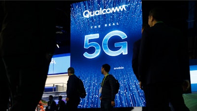 A sign advertises 5G at the Qualcomm booth at CES International in Las Vegas.