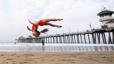 A student works on her skills during an acrobatics class near the pier in Huntington Beach, CA.