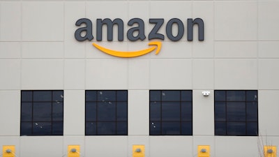 The Amazon DTW1 fulfillment center is shown in Romulus, Mich. Amazon is heading to space. The online shopping giant received government approval to put more than 3,200 satellites into orbit that would beam down internet service to earth. Amazon said the satellites could provide internet to parts of the world that don’t have it.