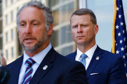 Acting Director of U.S. Immigration and Customs Enforcement Matt Albence comments Thursday, Aug. 6, 2020, in Jackson, Miss., after the announcement of the indictments of four executives from two Mississippi poultry processing plants on federal charges tied to one of the largest workplace immigration raids in the U.S. in the past decade. Their announcement happened a day before the one-year anniversary of the raids in which 680 people were arrested at seven poultry plants in central Mississippi. U.S. Attorney Mike Hurst listens in rear.