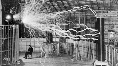 The inventor at rest, with a Tesla coil (thanks to a double exposure).