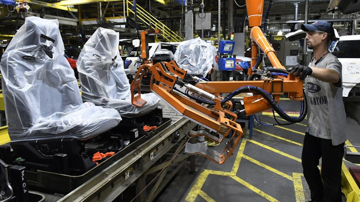 Workers assemble trucks at the Ford Kentucky Truck Plant in Louisville, Oct. 27, 2017.