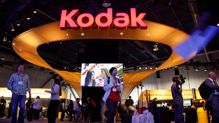 Buyers and industry affiliates pass by the Kodak exhibit at the 2012 International CES trade show in Las Vegas.