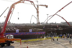 At the Atomic Energy Organization of Iran, concrete is poured for the base of the second nuclear power reactor.