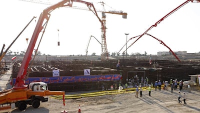 At the Atomic Energy Organization of Iran, concrete is poured for the base of the second nuclear power reactor.