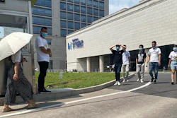 Employees exit the ByteDance headquarters in Beijing, Aug. 7, 2020.