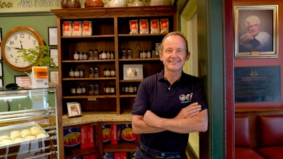 Chicago Alderman Tom Tunney poses inside his main Ann Sather restaurant.